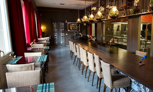 The dining room with the long table in the kitchen