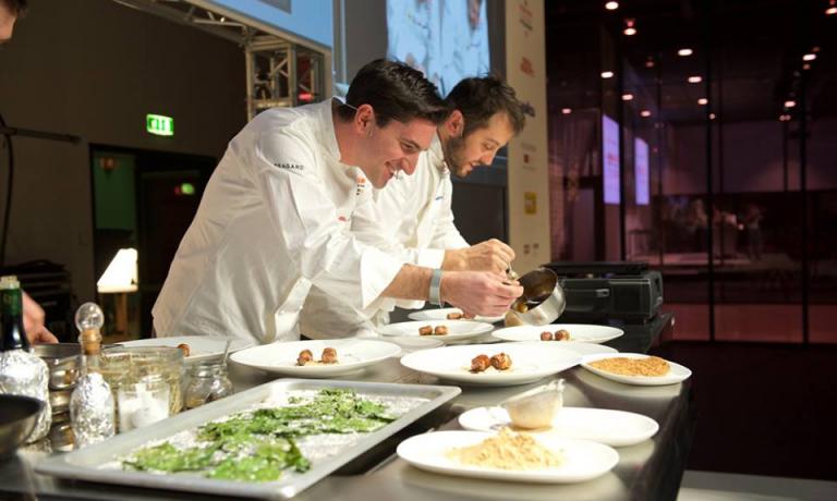Fabio Pisani and Alessandro Negrini, co-chefs at Il Luogo di Aimo e Nadia in Milan on the stage of Identità Milano. With Danilo Giaffreda, author of this article, they gave life to a lesson focused on the records of our culinary tradition, the forerunners of many of today’s trends in international fine dining (photo Brambilla/Serrani)